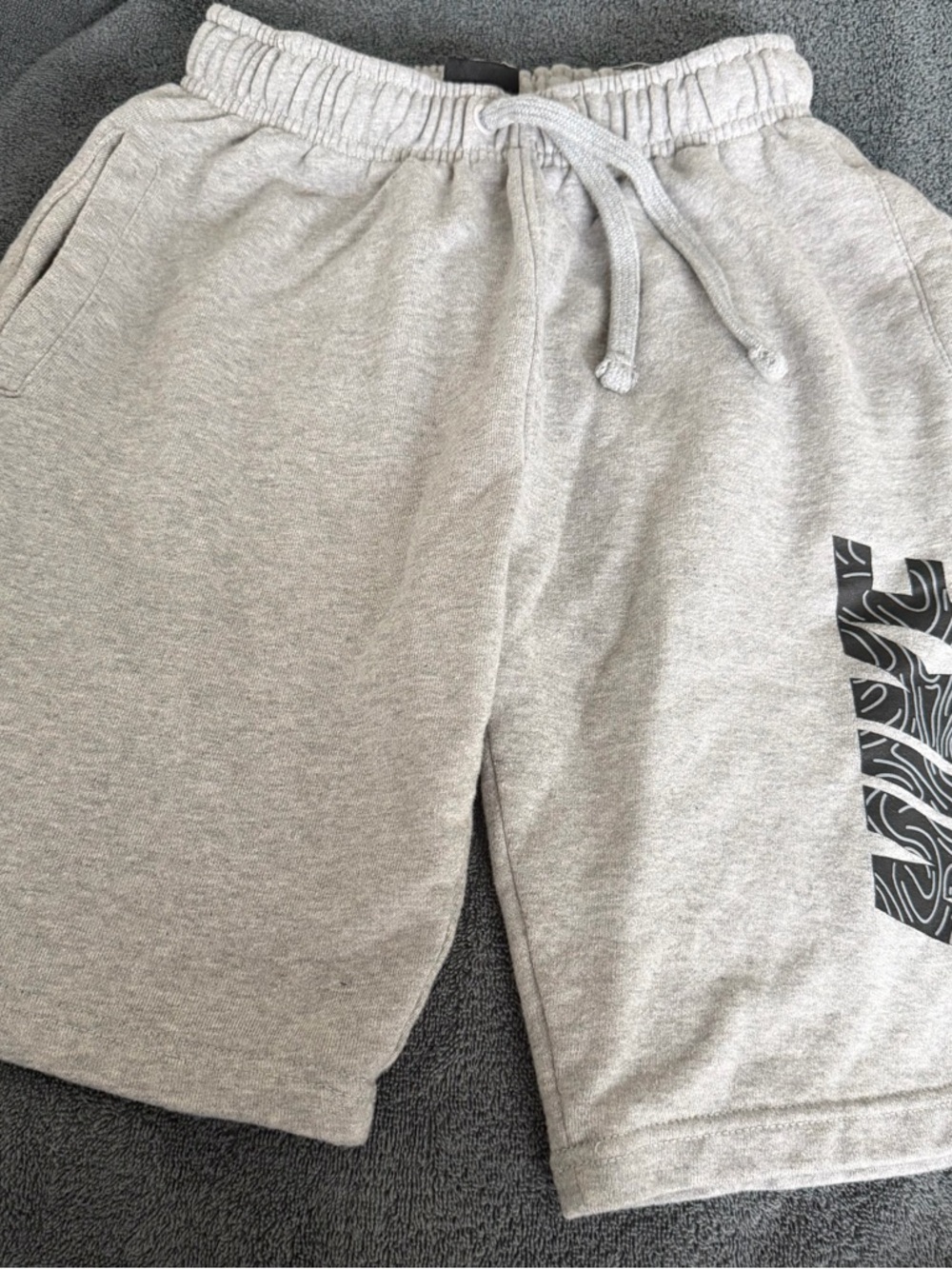 Nike Light Gray Athletic Shorts with Black Side Graphic